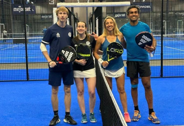 Group of padel players on a court