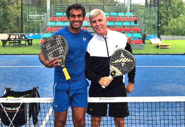 Two padel players on a court